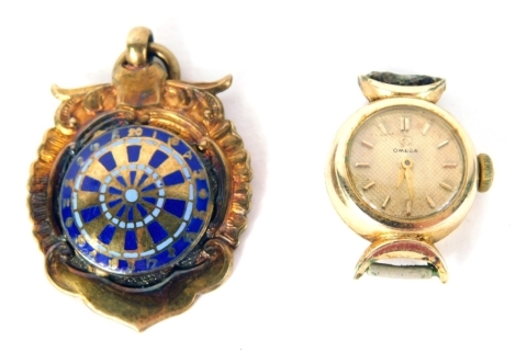 A 20thC Omega cocktail watch, with 0.5cm dial with baton pointers and numerals, in plated case, head only, and a silver gilt enamel fob, centred by dartboard.