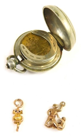 A silver plated spring loaded sovereign case, with faux Victorian sovereign, Lincoln Imp charm marked 9ct, 1.7g, and a further sporting charm, 1.2g. (3)