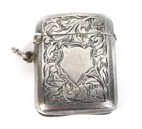 An Edward VII silver Vesta case, with vacant cartouche, decorated with scrolls and leaves, with match strike base and ring side, Birmingham 1908, 4cm high, 0.5oz.