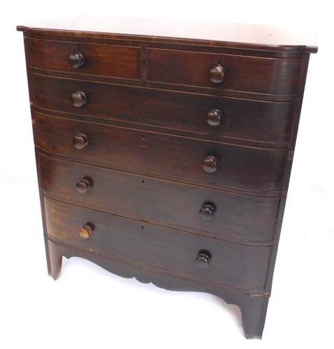 A Victorian mahogany bowfront chest, of two short and four long cockbeaded drawers, on splayed feet, 126cm high, 113cm wide, 58cm deep.