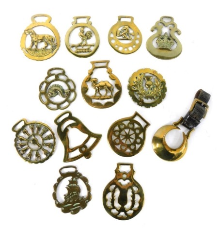 Various horse brasses, early 20thC, to include one centred with horse head, 9cm high, various others, later, cockerel horse brass, etc. (a quantity)