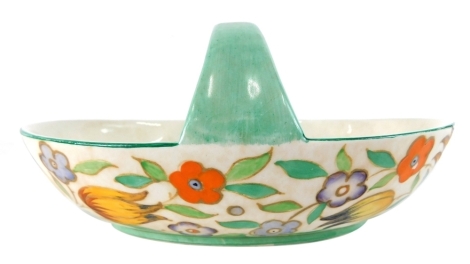 A 1930s Burleighware Charlotte Rhead basket, decorated with flowers, number 4052, raised and printed marks beneath, 12cm high.