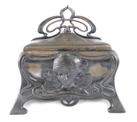 An Art Nouveau pewter finish casket, raised with masks and scrolls, with an elaborate flower head handle and plain interior, on spade shaped feet, marked beneath, 15cm high.