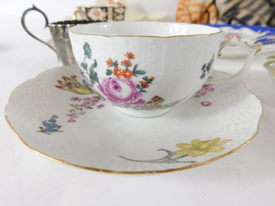 Various pottery and effects, an early 20thC Meissen porcelain teacup (AF) and saucer, hand painted with flowers, to include daffodils, with a lattice work border to each, blue cross sword marks beneath, 13cm wide, various Royal Crown Derby teacups, saucer - 2