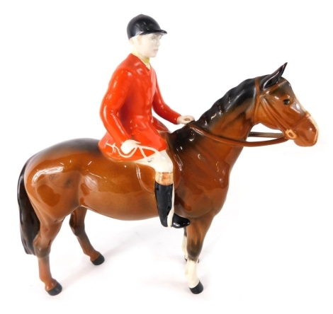 A Beswick pottery red jacketed huntsman, printed marks beneath, 17cm high.