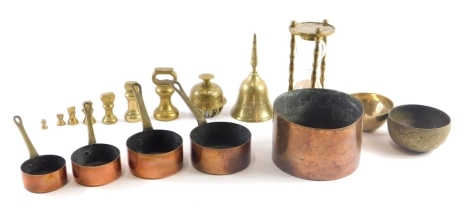 Various brassware, egg timer, a graduated small set of copper pans, bell, 15cm high. (a quantity)