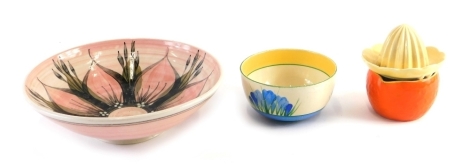 Various pottery, a 1930s Clarice Cliff Bizarre Blue Crocus pattern bowl, 12cm diameter, another orange shaped jug marked Clarice Cliff, a Allingham pottery bowl, predominantly in pink centred with flower, marked 72, and a lemon squeezer. (a quantity)