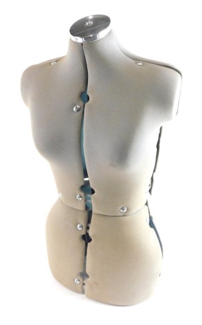 A modern mannequin torso, with chrome top and articulated body, 77cm high.