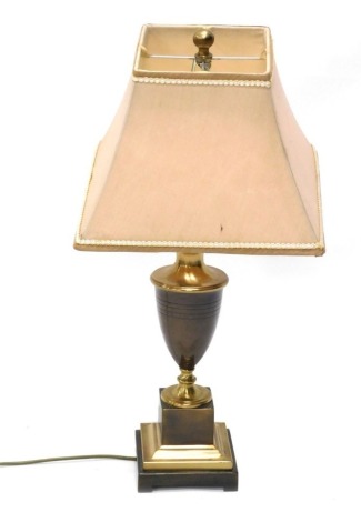 A table lamp, with urn stem, on stepped square base terminating in bracket feet, with modern shade and electrical fitting, 75cm high.