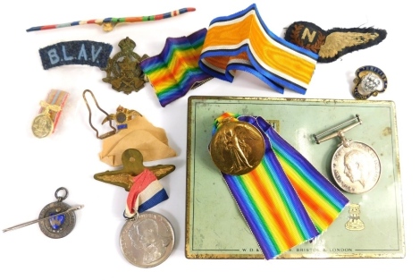 A World War I medal duo, comprising Campaign and Victory medals, each similarly marked 221715 SPR S Hook R E, with ribbons, small quantity of cap badges, in a Capstan Navy Cut tin.