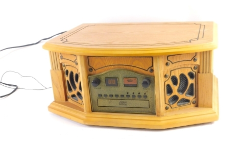 A modern wooden cased compact disc player, with front speakers and upper turntable, with lid, 21cm high, 48cm wide, 34cm deep.