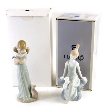 A Lladro figure Don't Forget Me, with box, printed and impressed marks beneath, 24cm high, another Lladro style figure and an associated box. (2)