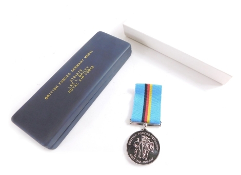 A Royal Air Force medal, marked LAC L Bailey RAE 2761473, in case marked British Forces Germany Medal Royal Air Force, the case 16cm wide.