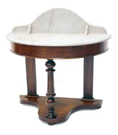 A late 19thC mahogany marble topped D end wash stand, with turned front support, on a platform base, terminating in compressed bun feet, 95cm high, 93cm wide, 49cm deep.