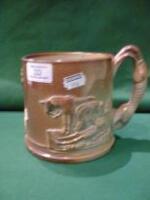 A Victorian salt glazed stoneware hound handle mug