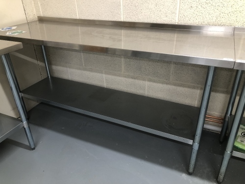 A stainless steel preparation table, 180cm x 60cm, with rear lip. Note: VAT is payable on the hammer price of this lot at 20%.