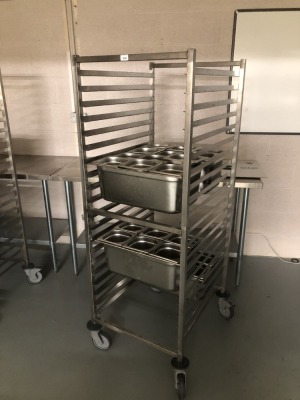 A Gastronorm stainless steel tray trolley, with three bains marie trays, each with six drop in GN bins. (Cost over £500+vat in 2022) Note: VAT is payable on the hammer price of this lot at 20%.