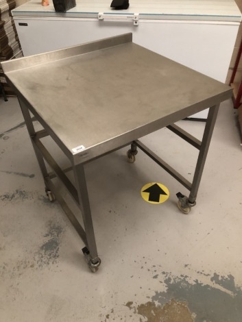 A stainless steel service trolley, 90cm high, 70cm square. Note: VAT is payable on the hammer price of this lot at 20%.