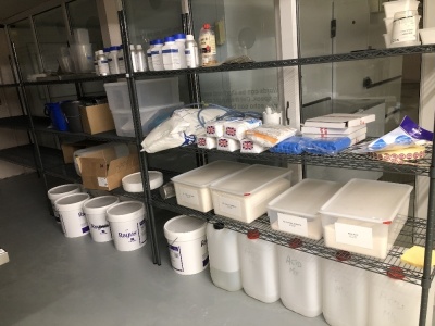 Sundries, including jugs, sieves, buckets, stock of potassium sorbate, etc. (all on shelves) Note: VAT is payable on the hammer price of this lot at 20%.