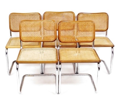 A set of five 1970s chrome framed dining chairs, each with a caned seat and back. (AF)