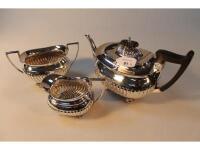 A late Victorian silver three piece tea service