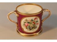 A puce ground late 19thC Staffordshire loving cup