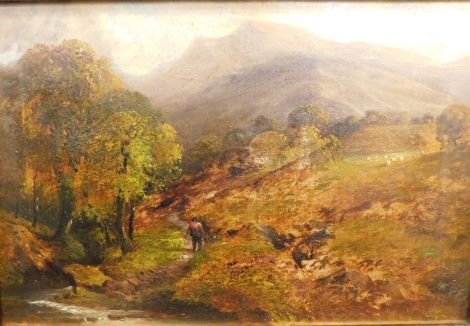 J. Green (19thC). Figure on a path before mountains, oil on canvas, signed, 31cm x 45cm. Illegible canvas stamp verso.