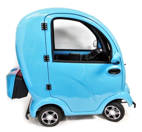 A Scooterpac cabin car MK2+, in blue trim, serial number 201909111, 2.8 registered miles, together with keys, electric charging cable and user manual.