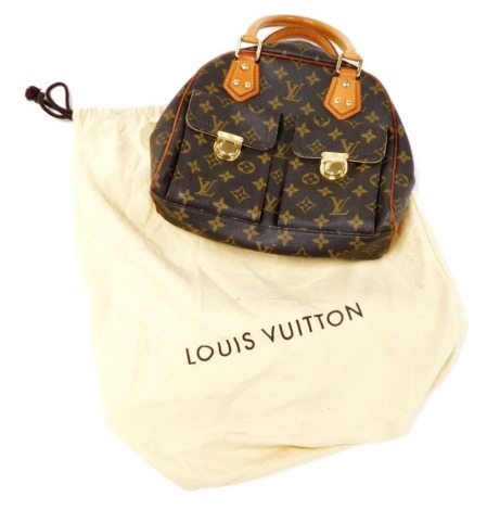 A Louis Vuitton monogram canvas Manhattan PM bag, the front with two compartments with brass monogrammed push lock clasps, the main body with a central zip enclosing a suede fitted interior, serial number FL0045, 25cm high, 25cm wide, 7cm deep, with cloth