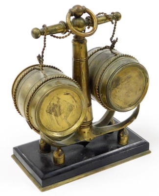 A 19thC brass nautical related combination clock and barometer, modelled in the form of a ship's anchor and two barrels, the enamel clock dial bearing Roman numerals and a subsidiary seconds dial, key wind, the centre with a mercury filled thermometer, ra - 3