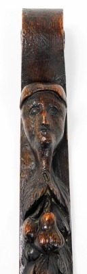 A 17thC carved oak caryatid, depicting the face of a man above carved fruit with scroll carved ends, 70cm high, 5.5cm wide. - 2