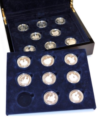 A bi-colour silver proof coin collection, to commemorate the 80th Birthday of Her Late Majesty Queen Elizabeth II, including ten and five dollar coins, five pounds, cased. (16)