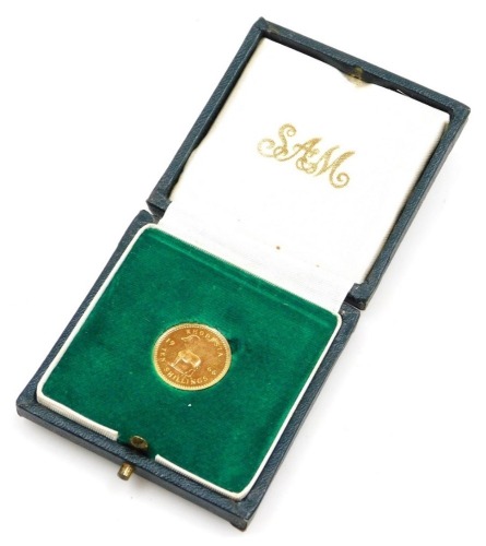 An Elizabeth II Rhodesia gold ten shilling, 1966, 3.9g, with Royal Mint case.