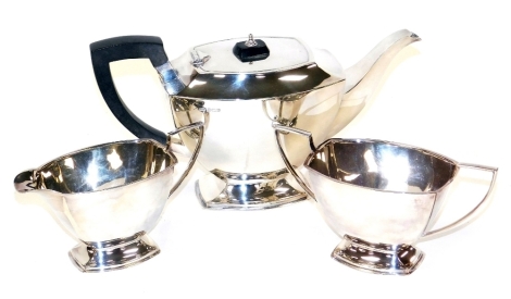 A George VI silver three piece tea set, each piece of tapering angular form, maker TL, Sheffield 1938, 31.91oz gross.