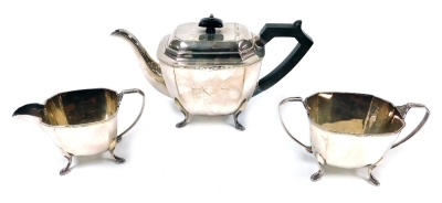 An Art Deco style community plate three piece tea set, comprising teapot, two handled sugar bowl, and milk jug.