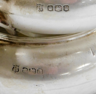 A George V silver two handled sugar bowl and matching cream jug, each of squat rounded form with ribbed rims, on a circular foot, Thomas Bradbury & Sons, Sheffield 1927, 8.68oz, together with an Elizabeth II silver coffee bean spoon, the reverse to the bo - 2