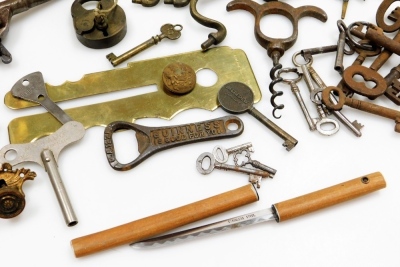 A group of collectables, to include iron keys, an Acme Guide whistle, furniture handles, brass lock, brass candlesticks, further keys, etc. (1 tray) NB. Imaged pistol not included. - 2