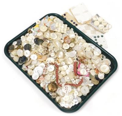 A collection of mother of pearl buttons, various sizes and styles, many large examples, 3.5cm diameter, coloured examples, etc. (1 tray)