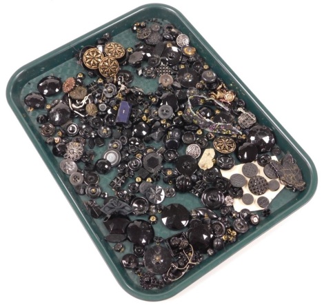 A collection of jet and other buttons, various sizes and designs, to include round faceted examples, gilt heightened buttons, etc. (1 tray)