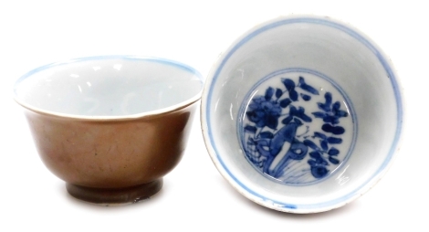 Two Chinese 18thC Batavia ware bowls, with typical brown outer glaze, the interior decorated with blue flowers and banding against a white ground, blue mark to underside, 9cm diameter.