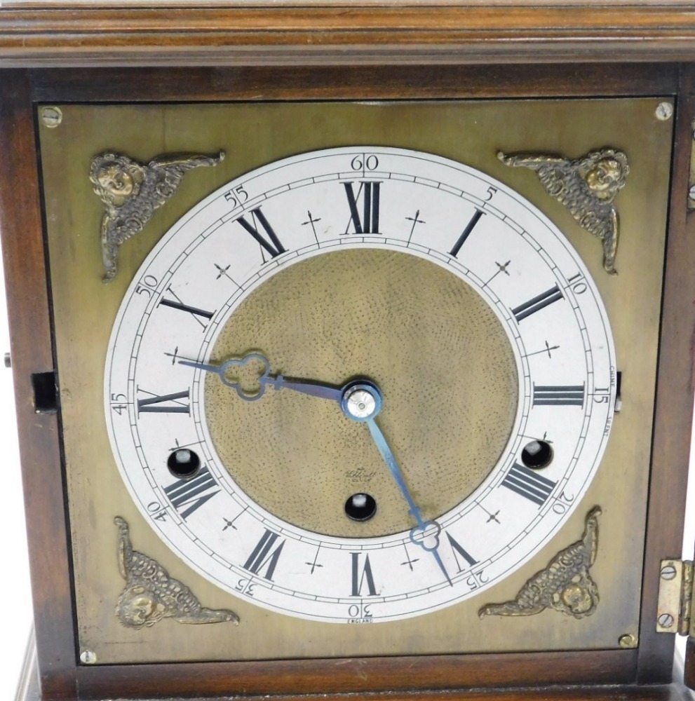 An early 20thC Elliot walnut cased mantel clock, square brass dial with ...