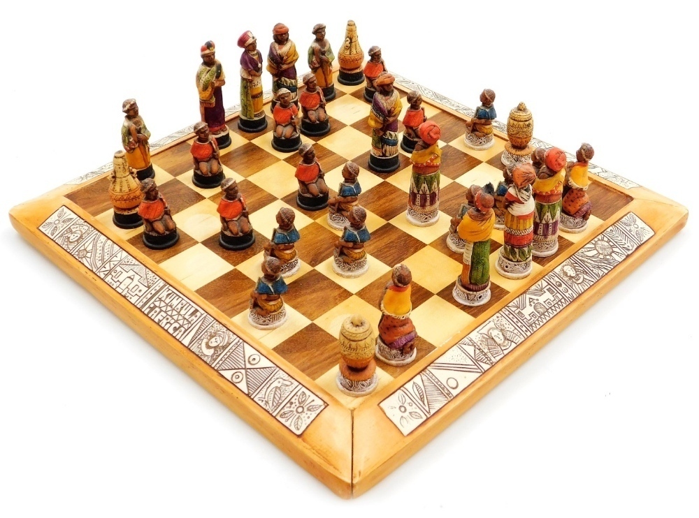 A 20thC Galastar CC painted chess set, modelled as indigenous tribesman ...