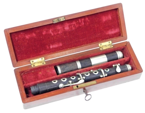 A rosewood cased piccolo, mahogany cased, with key.