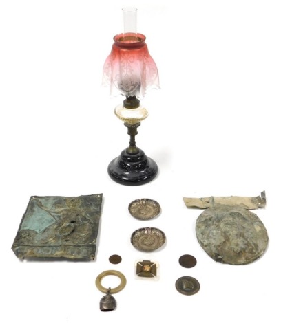 Two 18thC vintage lead insurance plaques, brass and glass oil lamp with a cranberry and frosted glass shade, pair of white metal dishes, 1837 Coronation silver baby's rattle with teething ring, coin token and medals, including a Newark token for one penny