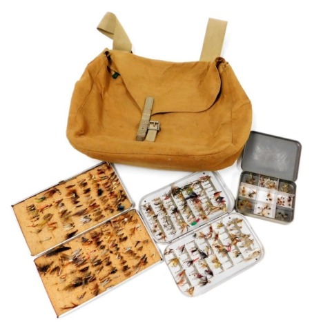 A small canvas fishing bag and flies, including a Wheatley alloy fly case, another alloy fly case, lock leaver box, and net flies, nymphs and dry flies.