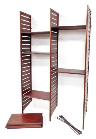 A mid century teak Ladderax type modular shelving unit, formed as two units with an arrangement of shelves, 195cm high, 124cm wide, 37cm deep.