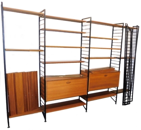 A Staples Ladderax modular shelving system, with an arrangement of shelves, and two wall cupboards, each with a fall. (a quantity)