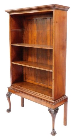 A 19thC and later bookcase on stand, the top with a moulded cornice, enclosing three shelves, the base raised on carved cabriole legs terminating in ball and claw feet, made up, 181cm high, 107cm wide, 36cm deep.