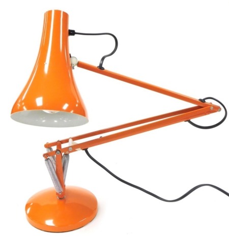 An orange Anglepoise type lamp, 86cm high.