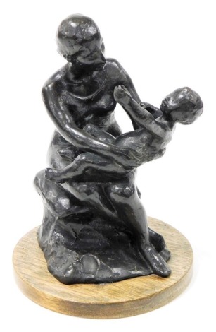 20thC School. Bronze study of a mother of and child, mounted on a circular hardwood base, impressed seal mark, 25cm high.